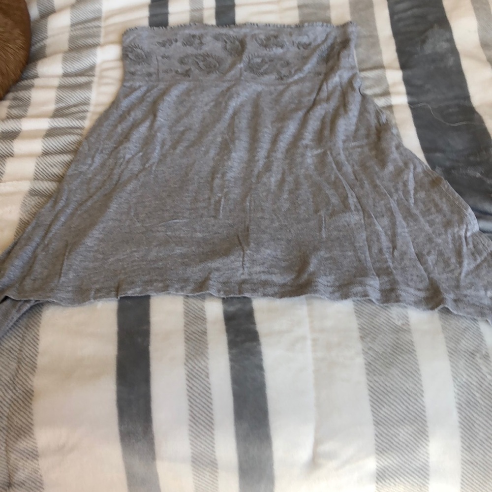 Gray sleeveless top.